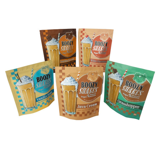 Six pouches of Boozy Shakes Bourbon Brownie 6 Pack are arranged together. Just add water and bourbon for easy, blender-free boozy milkshakes—all natural ingredients, delicious flavor!.