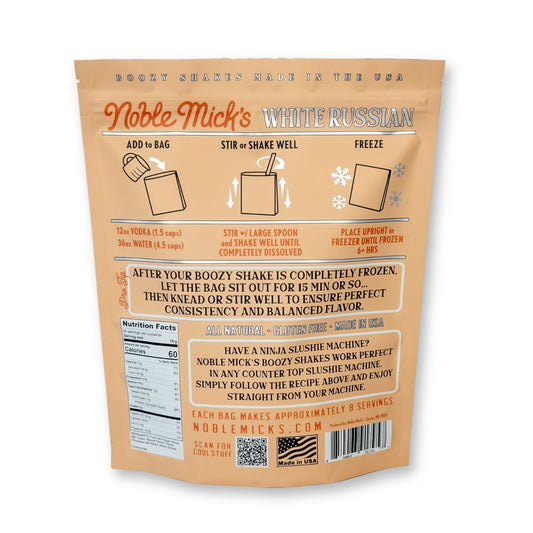 Back of a Boozy Shakes White Russian 6 Pack bag shows instructions, all natural ingredients, nutrition facts, and steps for easy frozen milkshakes. The tan pack has orange and white text—just add water and vodka, no blender needed!.